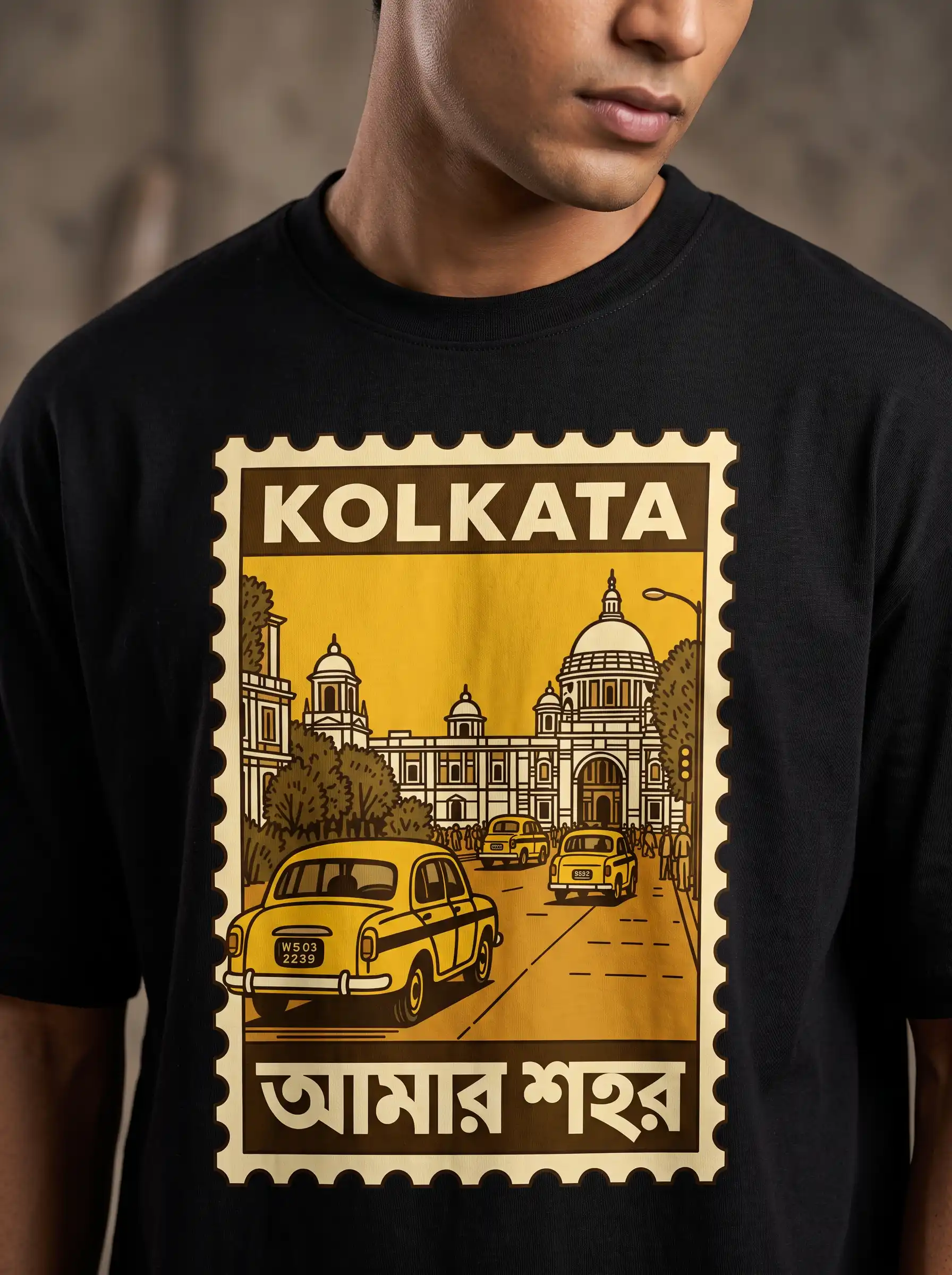 Close-up of the Kolkata postage-stamp graphic print on a black Storyteller t-shirt