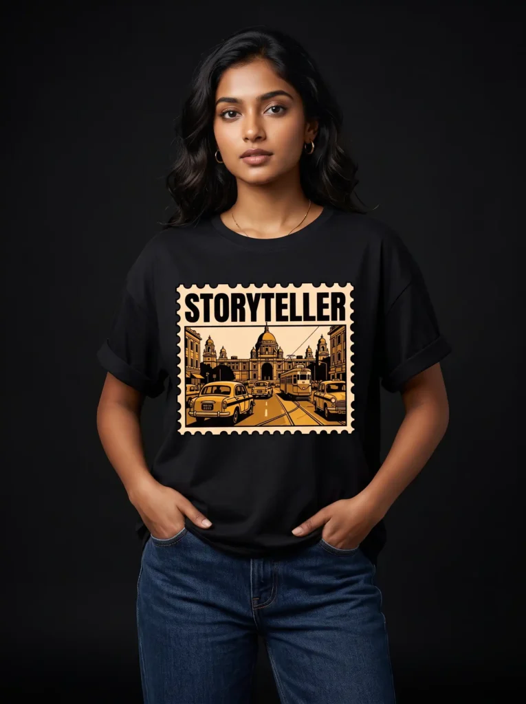 Woman wearing a black Storyteller Kolkata graphic t-shirt, studio shot on black background