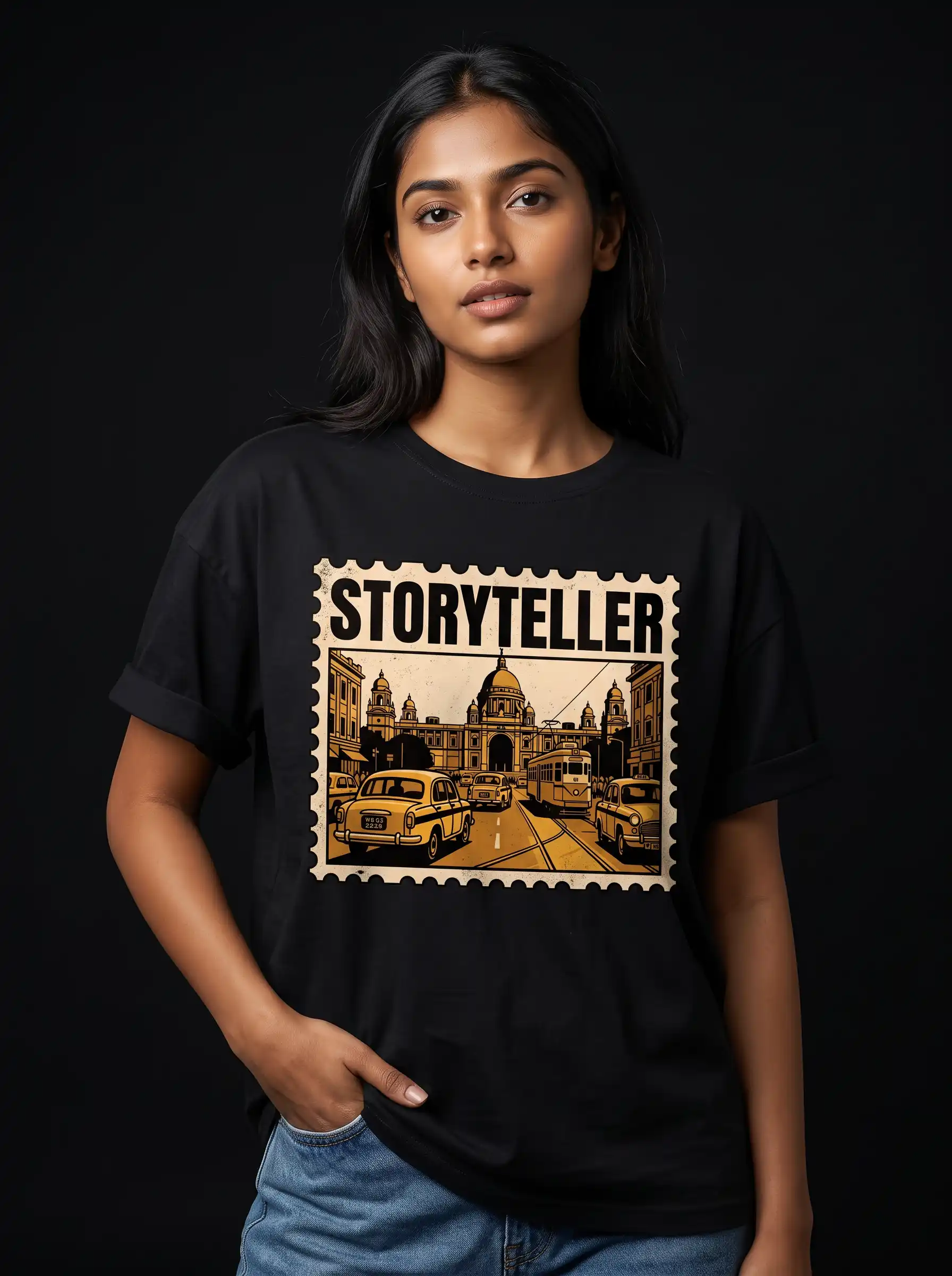 Woman wearing a black Storyteller Kolkata graphic t-shirt against a dark studio background