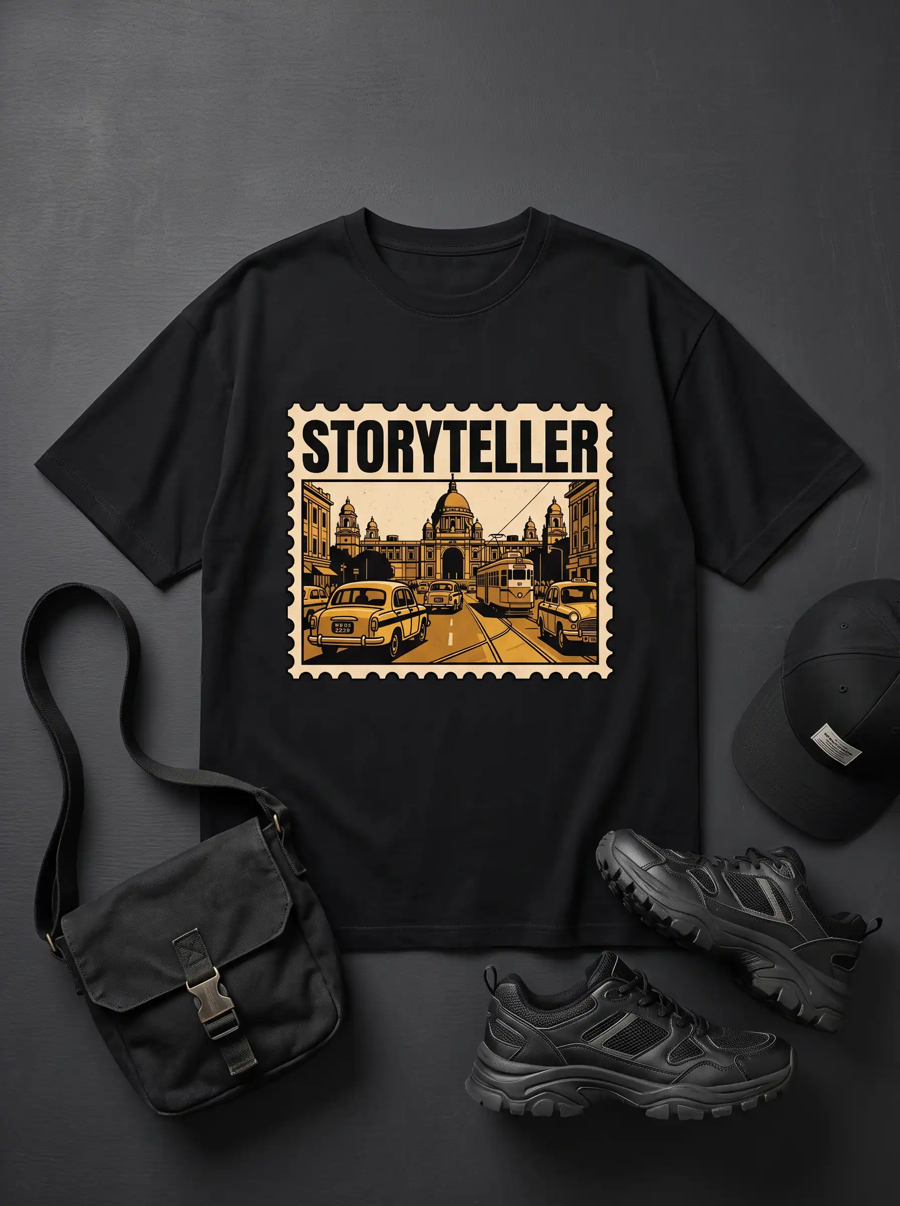 Storyteller graphic t-shirt flat lay with cap, sling bag and black sneakers on a grey background